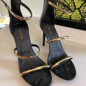 Bebe black and gold heels
